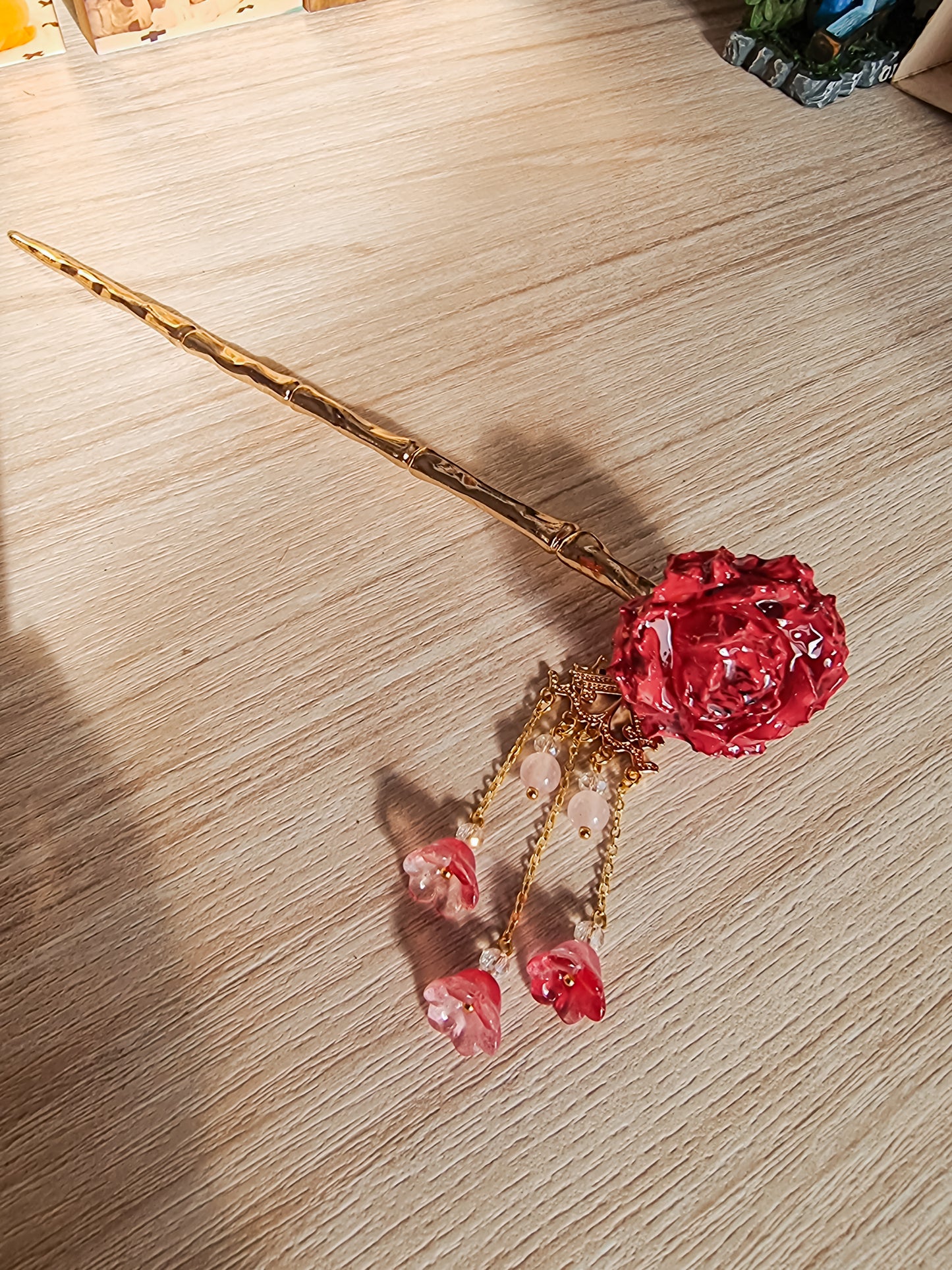 Red Rosa with gold hairpin