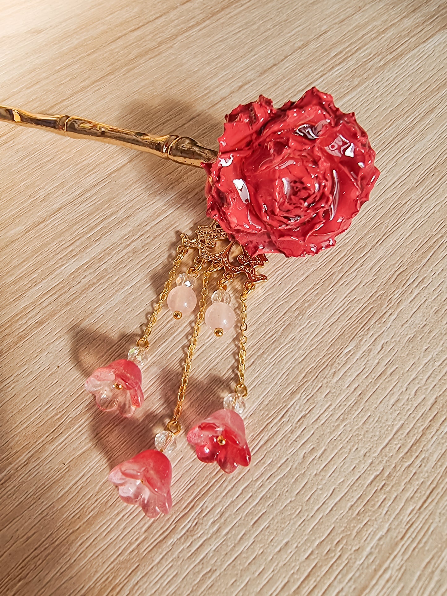 Red Rosa with gold hairpin