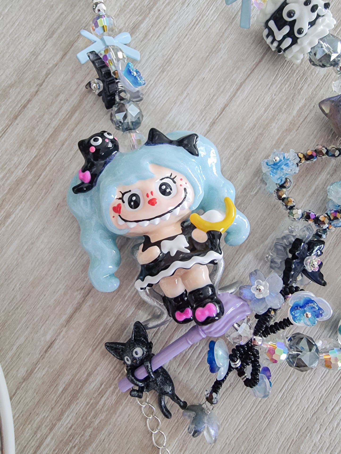 Handpainted labubu with blue hair strap