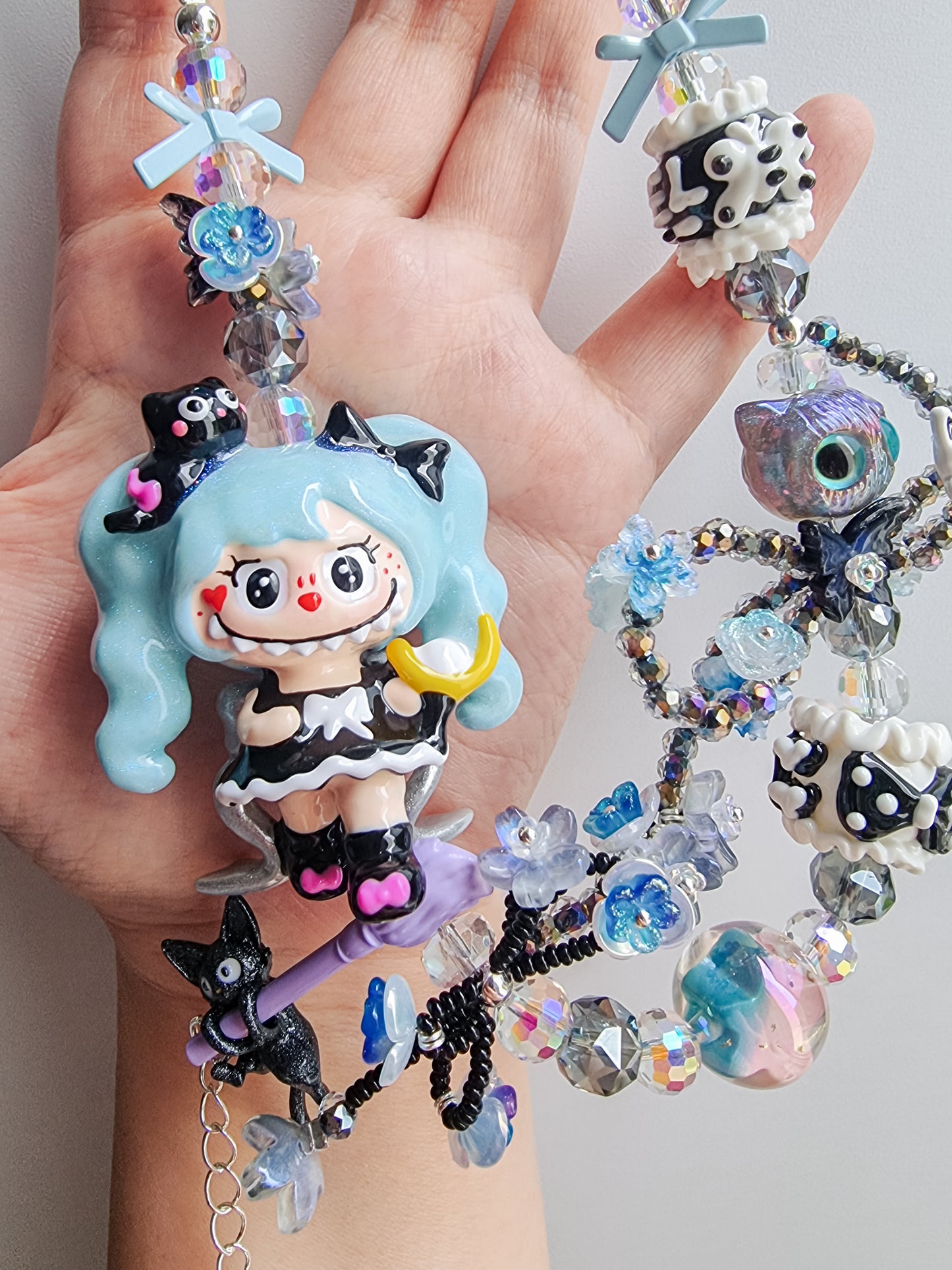 Handpainted labubu with blue hair strap